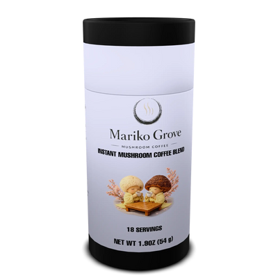 a light blue tube of Instant Mushroom Coffee branded Mariko Grove, decorated with a picture of 2 mushroom people dressed in yellow kimonos enjoying a cup.